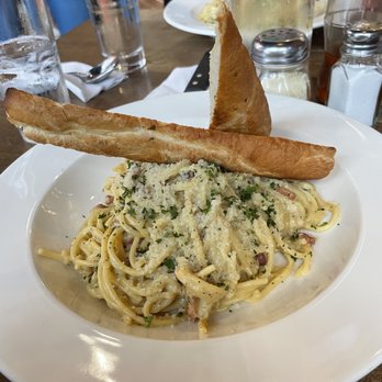 Panini's Italian Cucina - Carbonera with garlic bread add some chilli oil and it is amazing. - Pizza Near Me - Edmonton, Alberta Panini's Italian Cucina - Carbonera with garlic bread add some chilli oil and it is amazing. - Pizza Near Me - Edmonton, Alberta