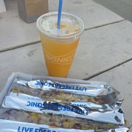 2 chili dogs and mango slushy. 2 chili dogs and mango slushy.