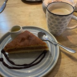 The Red Lion - Warm apple cake with custard and berry sauce.