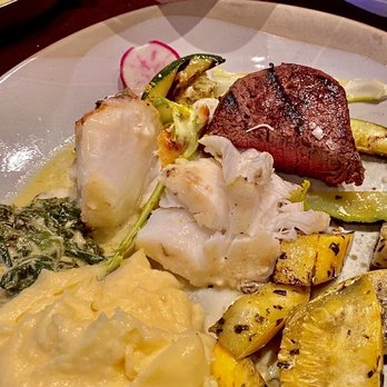 A Land Remembered - Entrees: Chilean Sea Bass & Filet Mignon (Medium) Accompaniments: Mashed potatoes & creamed spinach - Steakhouses Near Me - Orlando, Florida A Land Remembered - Entrees: Chilean Sea Bass & Filet Mignon (Medium) Accompaniments: Mashed potatoes & creamed spinach - Steakhouses Near Me - Orlando, Florida