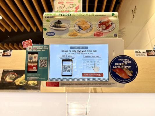 Kura Revolving Sushi Bar by null