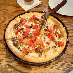 Vegan Cheeseburger Deep Dish Pizza: Vegan cheese Beyond Beef, onions, pickles, ketchup, mustard
