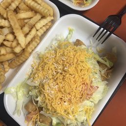 Beef rolled tacos and a side of fries Beef rolled tacos and a side of fries