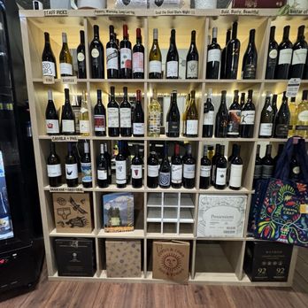 Spin the Bottle - A wall of good juice - Beer, Wine & Spirits Near Me - Chandler, Arizona