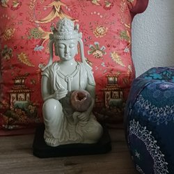 Southwestern Minerals - Goddess of Compassion Quan Yin holding agate sphere with crystal druzy opening