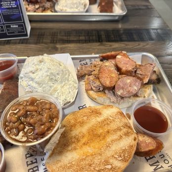 Blue Ember Smokehouse - A Special Op's sandwich with brisket, pulled pork and sausage. Highly recommend this sandwich - Barbeque Near Me - Hot Springs, Arkansas Blue Ember Smokehouse - A Special Op's sandwich with brisket, pulled pork and sausage. Highly recommend this sandwich - Barbeque Near Me - Hot Springs, Arkansas