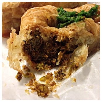 Poseidon Bakery - Afali (roll of chopped pistachios surrounded by phyllo and dipped in honey) - Bakeries Near Me - New York, New York Poseidon Bakery - Afali (roll of chopped pistachios surrounded by phyllo and dipped in honey) - Bakeries Near Me - New York, New York