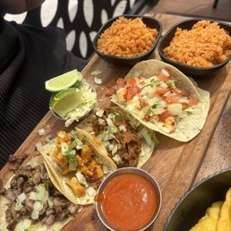 Tacos!! Carne asada, chicken, shrimp, and pork. Double rice sides as my daughter doesn't like beans.