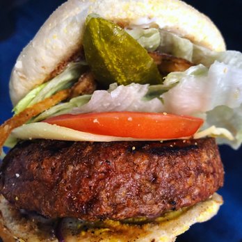 Huey's Midtown - Huey's VEGAN Beyond Burger with vegan gouda. (Ignore the giant pickle I added lol) - Burgers Near Me - Memphis, Tennessee