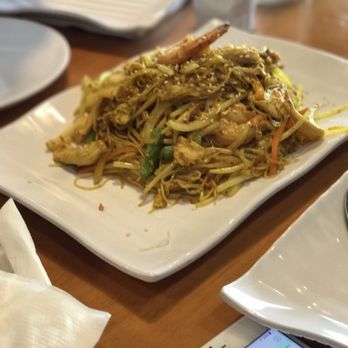 Toss Thai - a plate of noodles and shrimp on a table - Asian Fusion Near Me - Milton, Ontario Toss Thai - a plate of noodles and shrimp on a table - Asian Fusion Near Me - Milton, Ontario