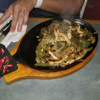 Restaurante Mexicano La Cascada - a person stirring up a dish - Mexican Near Me - Tampa, Florida