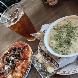 a bowl of soup and a plate of pizza a bowl of soup and a plate of pizza