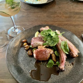 Spoon and Stable - August 2020: lamb Rack entree & watermelon gin & tonic. Squash blossom risotto across the table. - New American Near Me - Minneapolis, Minnesota