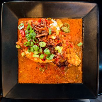 Goat Head - Children of the Corn -- Gulf shrimp and over-easy egg on polenta, covered in Cajun sauce, topped with bacon and green onions - Breakfast & Brunch Near Me - Salt Lake City, Utah
