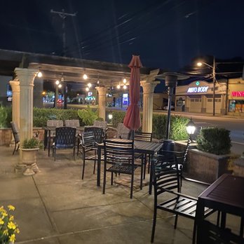Piccolo's - tables and chairs outside at night - Italian Near Me - Mineola, New York Piccolo's - tables and chairs outside at night - Italian Near Me - Mineola, New York