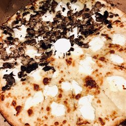 All Star Pizza - All star White pizza with mushrooms on half.