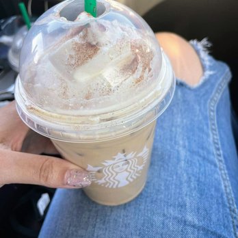 Starbucks - a hand holding a cup of iced coffee - Coffee & Tea Near Me - Bolingbrook, Illinois