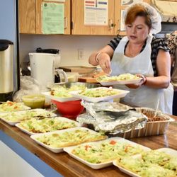 Community Action Partnership of Orange County - A volunteer prepares lunches at our Anaheim Independencia Family Resource Center