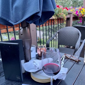 The Fitz - a glass of wine on a table - Bars Near Me - Vail, Colorado