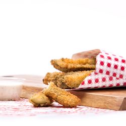 Git'N Go Market - 5 crunchy dill pickle spears are battered and deep fried to a golden brown.
