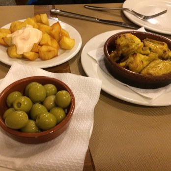 Colom - Patatas bravas, stuffed olives, chicken wings. Wings were kind of greasy, patatas bravas ok, but olives were tasty - Spanish Near Me - Barcelona, B