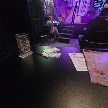 Mic Drop Comedy - No drink, empty table. - Comedy Clubs Near Me - Plano, Texas Mic Drop Comedy - No drink, empty table. - Comedy Clubs Near Me - Plano, Texas