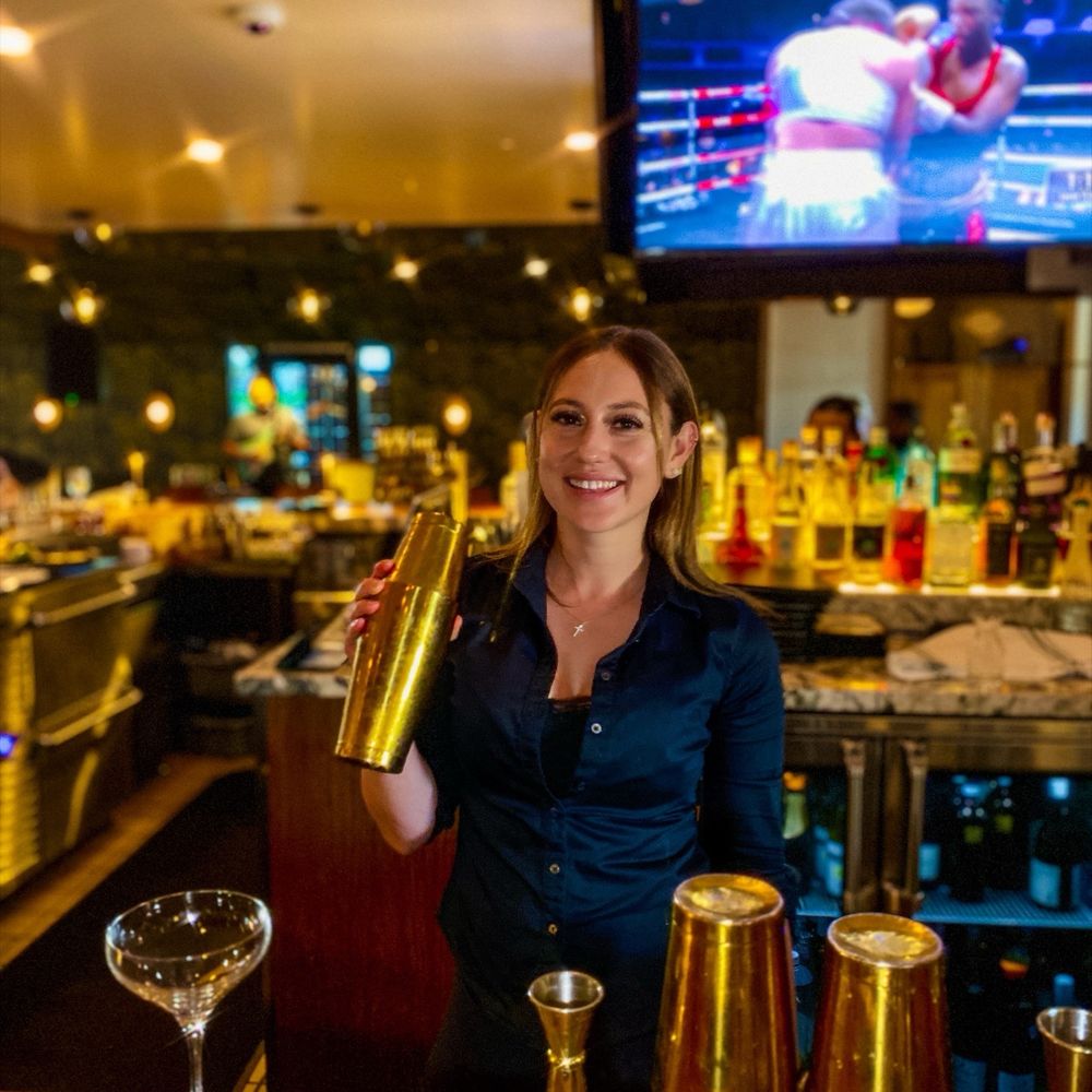 Sette Sorelle - Bartender Katie crafting cocktails. - Italian Near Me - Thousand Oaks, California Sette Sorelle - Bartender Katie crafting cocktails. - Italian Near Me - Thousand Oaks, California