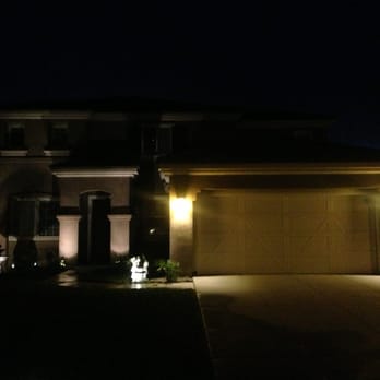 Premier Construction - a home at night - Electricians Near Me