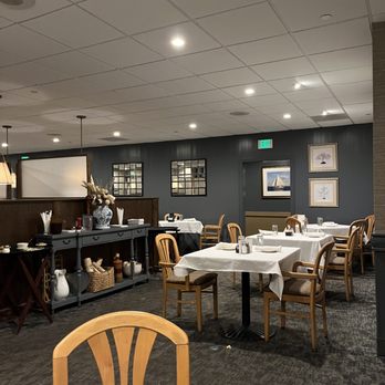 Peppermill Restaurant - tables and chairs with white tablecloths - American Near Me - Lutherville, Maryland