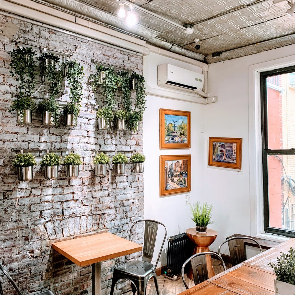 PROOF Coffee Roasters - a brick wall with potted plants - Coffee & Tea Near Me - New York, New York PROOF Coffee Roasters - a brick wall with potted plants - Coffee & Tea Near Me - New York, New York