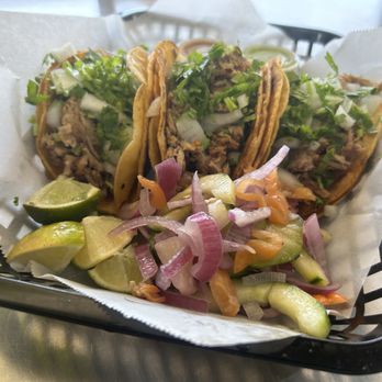 Tacos El Guante - three tacoss in a basket - Food Trucks Near Me Tacos El Guante - three tacoss in a basket - Food Trucks Near Me