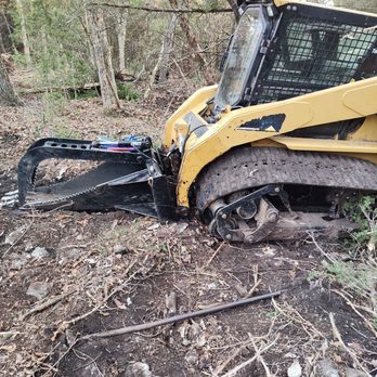 Poage & Sons Land Clearing - Poage was able to tear out the cedars with this attachment. Soil disturbance was less than digging them out. - Excavation Services Near Me
