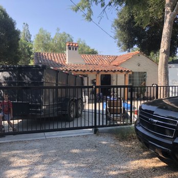 Twin Oaks Manufacturing - The black rolling child proof gate to the iron fence. - Metal Fabricators Near Me - San Jose, California Twin Oaks Manufacturing - The black rolling child proof gate to the iron fence. - Metal Fabricators Near Me - San Jose, California