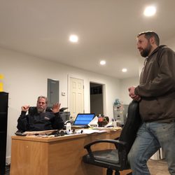 Moore Bros Body & Paint - Scott (left) and Tom (right) conversing to a customer.