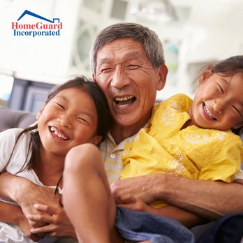 HomeGuard - an older man and two young girls sitting on a couch - Home Inspectors Near Me - Livermore, California HomeGuard - an older man and two young girls sitting on a couch - Home Inspectors Near Me - Livermore, California