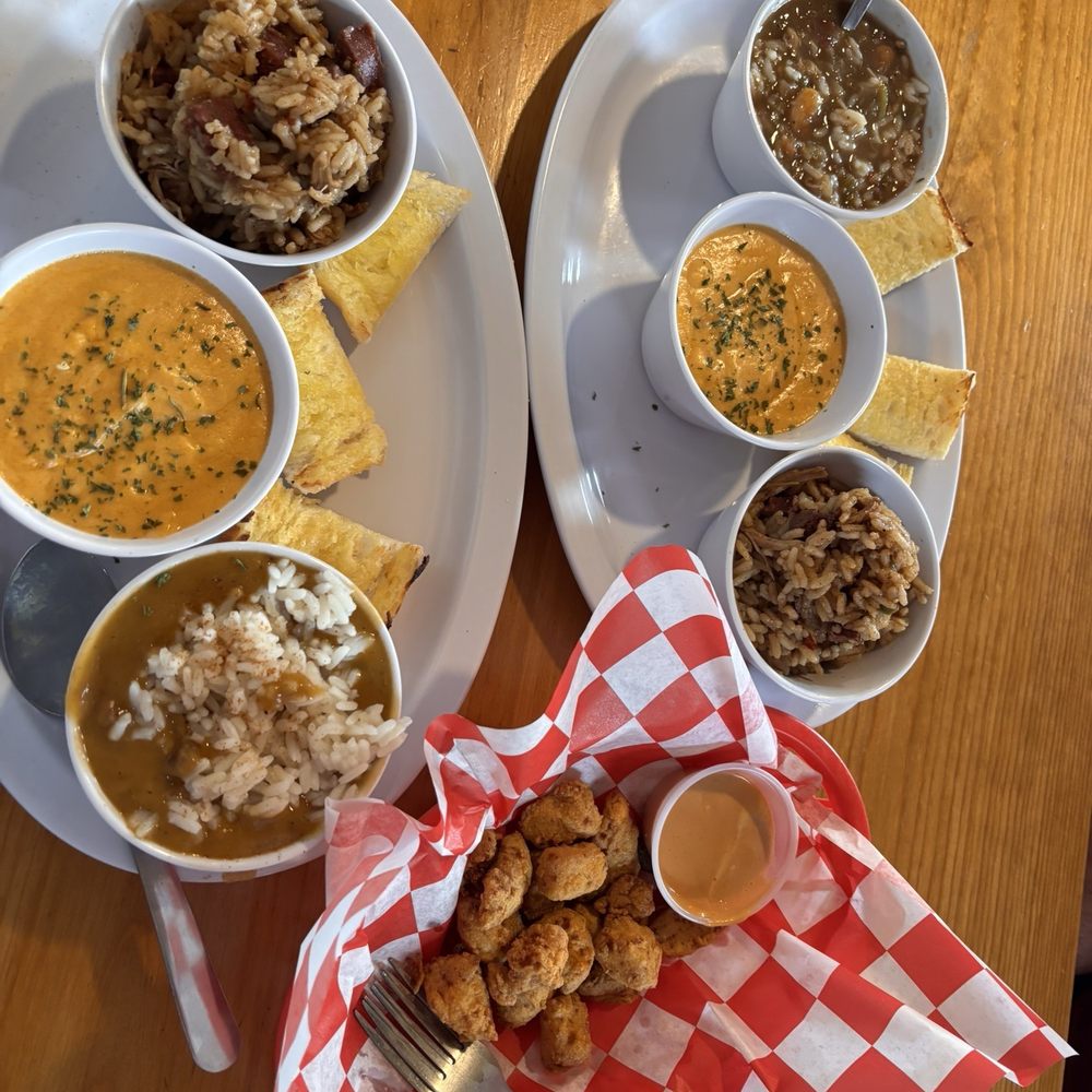 Trio left crawfish étouffée, lobster bisque, jambalaya. Trio right jambalaya, lobster bisque, seafood gumbo. App gator bites. Trio left crawfish étouffée, lobster bisque, jambalaya. Trio right jambalaya, lobster bisque, seafood gumbo. App gator bites.