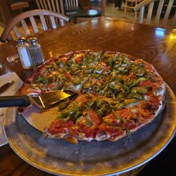 The Wheelhouse - Cheese pizza with green peppers, tomatoes, green olives and jalapeños.