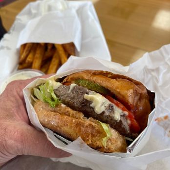 The Cheesesteak Grill - a hand holding a sandwich - Cheesesteaks Near Me - Oceanside, California The Cheesesteak Grill - a hand holding a sandwich - Cheesesteaks Near Me - Oceanside, California