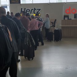 Hertz Rent A Car - Hmmm....I'm getting a Dollar rental, but standing in a Hertz line with one person at the counter.  Nice