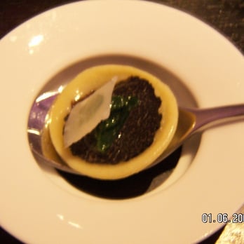Alinea - Black Truffle Explosion, romaine, parmesan. Note bottomless dish! - New American Near Me - Chicago, Illinois Alinea - Black Truffle Explosion, romaine, parmesan. Note bottomless dish! - New American Near Me - Chicago, Illinois