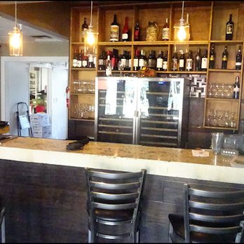 Five Ten Bistro - As you enter the restaurant, you'll notice the small bar with only four stools. - Bars Near Me - Merced, California