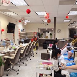 Me Time Spa - Happy customers enjoying pedicures and relaxing with our Vietnamese New Year decorations.