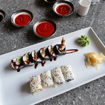 Sushi Mocki - a plate of sushi and sauces - Sushi Bars Near Me - Dallas, Texas