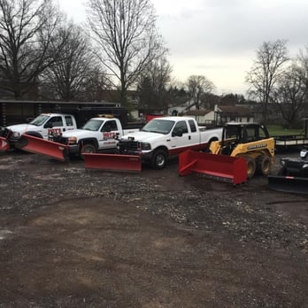 Hoy's Landscaping - a row of snow plow trucks - Snow Removal Near Me - Hatfield, Pennsylvania Hoy's Landscaping - a row of snow plow trucks - Snow Removal Near Me - Hatfield, Pennsylvania