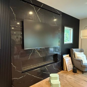 Fair Fix Handymen Group - TV Mounted on a Marble Fireplace Wall - Handyman Near Me - Fairfax, Virginia Fair Fix Handymen Group - TV Mounted on a Marble Fireplace Wall - Handyman Near Me - Fairfax, Virginia