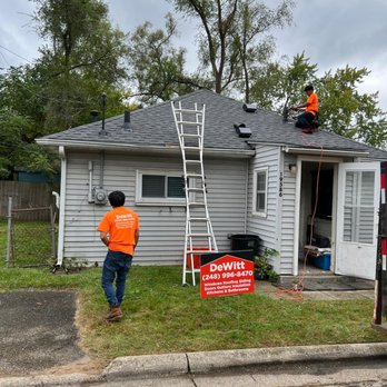 DeWitt Building & Construction - a man on a ladder working on the roof of a house - Roofing Near Me - Southfield, Michigan DeWitt Building & Construction - a man on a ladder working on the roof of a house - Roofing Near Me - Southfield, Michigan