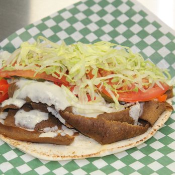Maina's Donair - a close up of a sandwich - Donairs Near Me - Beaumont, Alberta Maina's Donair - a close up of a sandwich - Donairs Near Me - Beaumont, Alberta