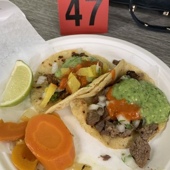 Carmelo's Tacos - al pastor taco (left) carne asada taco (right) - Tacos Near Me - Seattle, Washington Carmelo's Tacos - al pastor taco (left) carne asada taco (right) - Tacos Near Me - Seattle, Washington