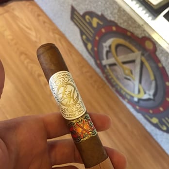 S&A Cigars - a hand holding a cigar - Cigar Bars Near Me - Watertown, Massachusetts S&A Cigars - a hand holding a cigar - Cigar Bars Near Me - Watertown, Massachusetts