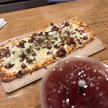 Mad Cow Grill - Jerk Chicken Flatbread Sangria with Hennessy - American Near Me - Laurel, Maryland Mad Cow Grill - Jerk Chicken Flatbread Sangria with Hennessy - American Near Me - Laurel, Maryland
